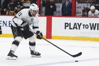 Nov 9, 2025; Pittsburgh, Pennsylvania, USA;  Los Angeles Kings center Anze Kopitar (11) skates with the puck against the Pittsburgh Penguins during the second period at PPG Paints Arena. Mandatory Credit: Charles LeClaire-Imagn Images