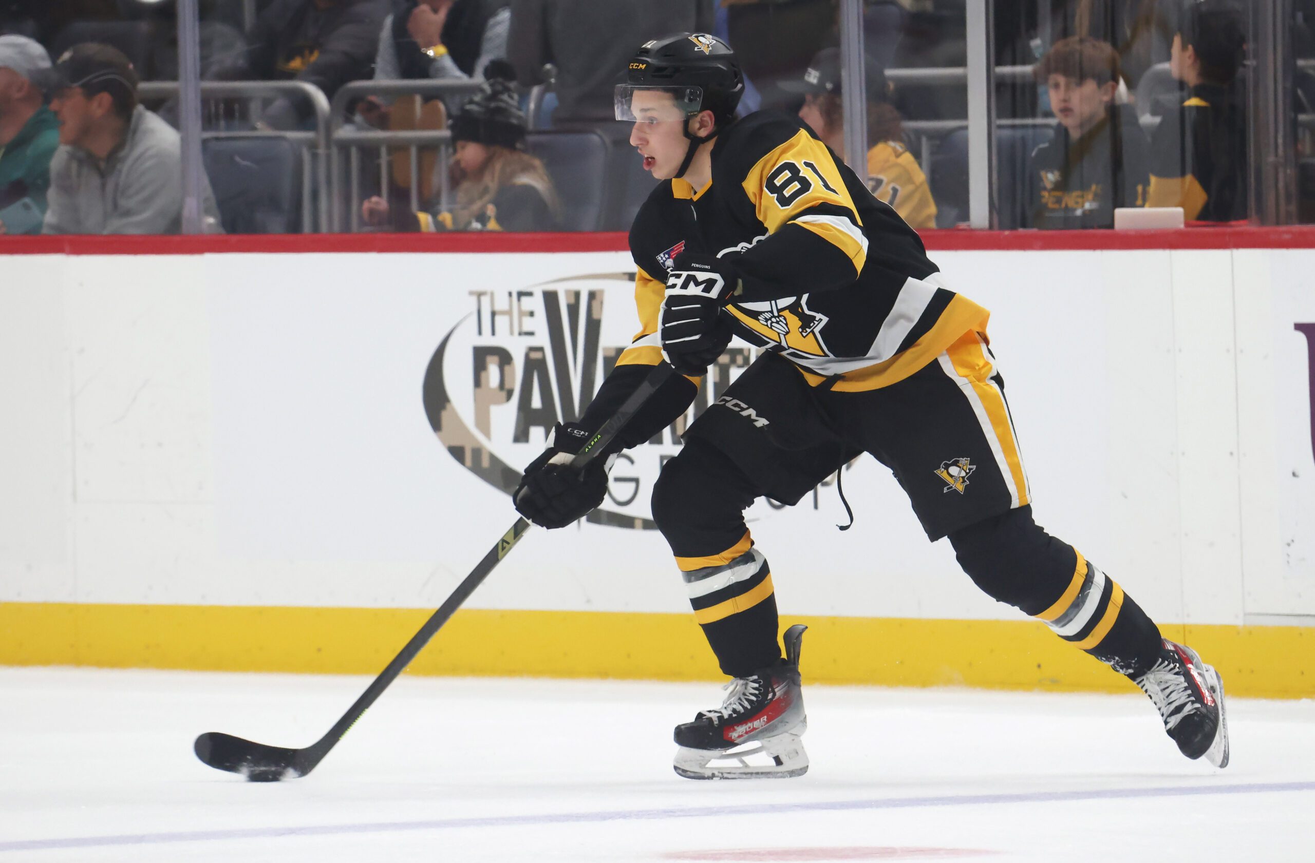 Nov 9, 2025; Pittsburgh, Pennsylvania, USA;  Pittsburgh Penguins center Ben Kindel (81) moves the puck against the Los Angeles Kings during the second period at PPG Paints Arena. Mandatory Credit: Charles LeClaire-Imagn Images