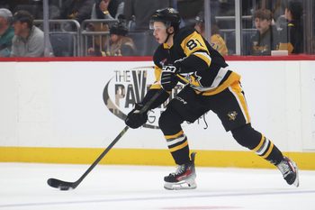 Nov 9, 2025; Pittsburgh, Pennsylvania, USA;  Pittsburgh Penguins center Ben Kindel (81) moves the puck against the Los Angeles Kings during the second period at PPG Paints Arena. Mandatory Credit: Charles LeClaire-Imagn Images