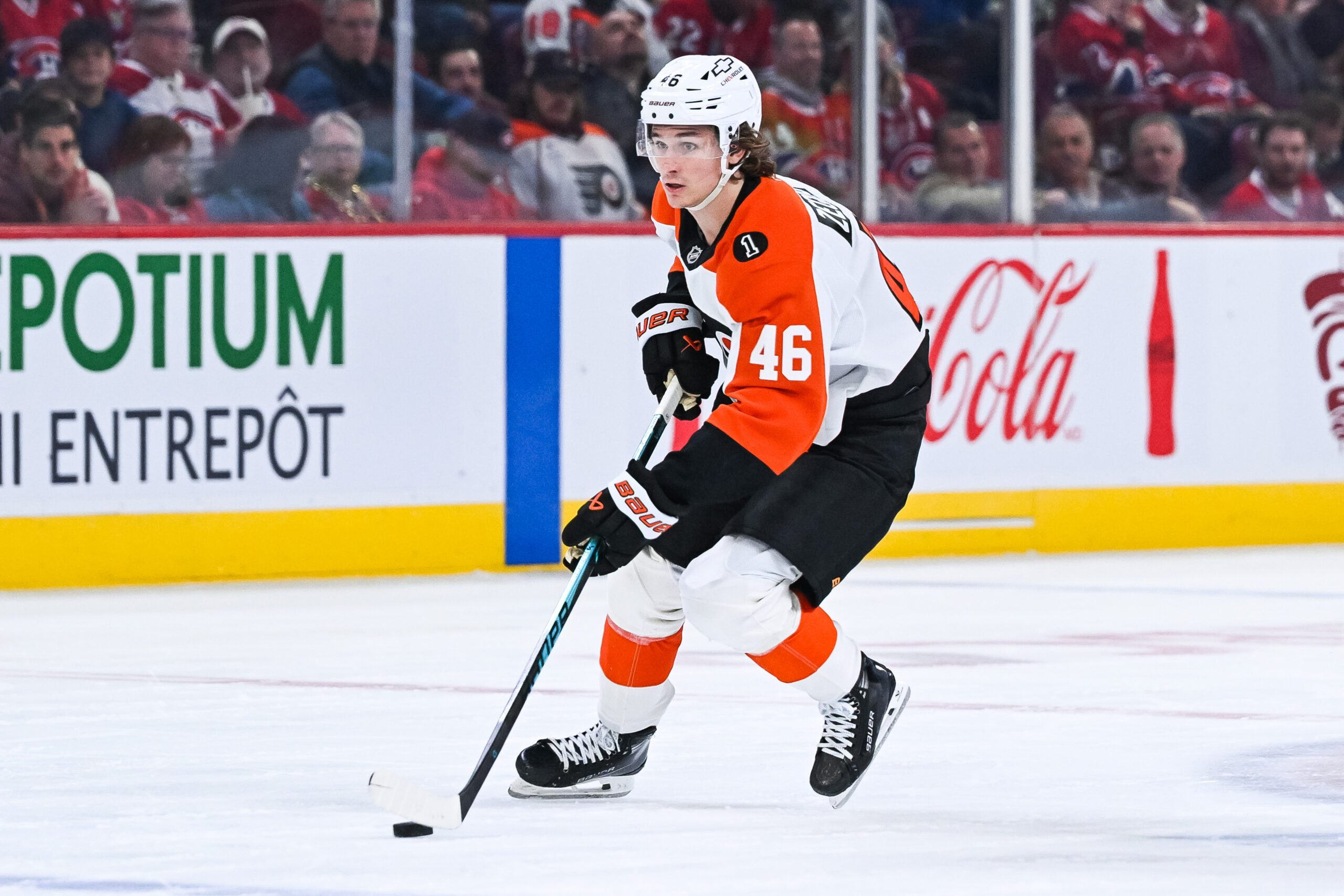 Nov 4, 2025; Montreal, Quebec, CAN; Philadelphia Flyers center Trevor Zegras (46) plays the puck against the Montreal Canadiens during the third period at Bell Centre. Mandatory Credit: David Kirouac-Imagn Images