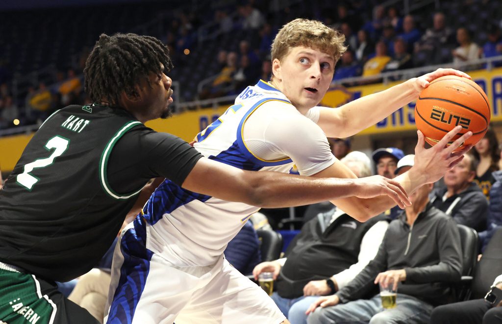 Nov 10, 2025; Pittsburgh, Pennsylvania, USA; Eastern Michigan Eagles guard Carlos Hart (2) guards Pittsburgh Panthers guard Nojus Indrusaitis (25) during the second half at Petersen Events Center. Mandatory Credit: Charles LeClaire-Imagn Images