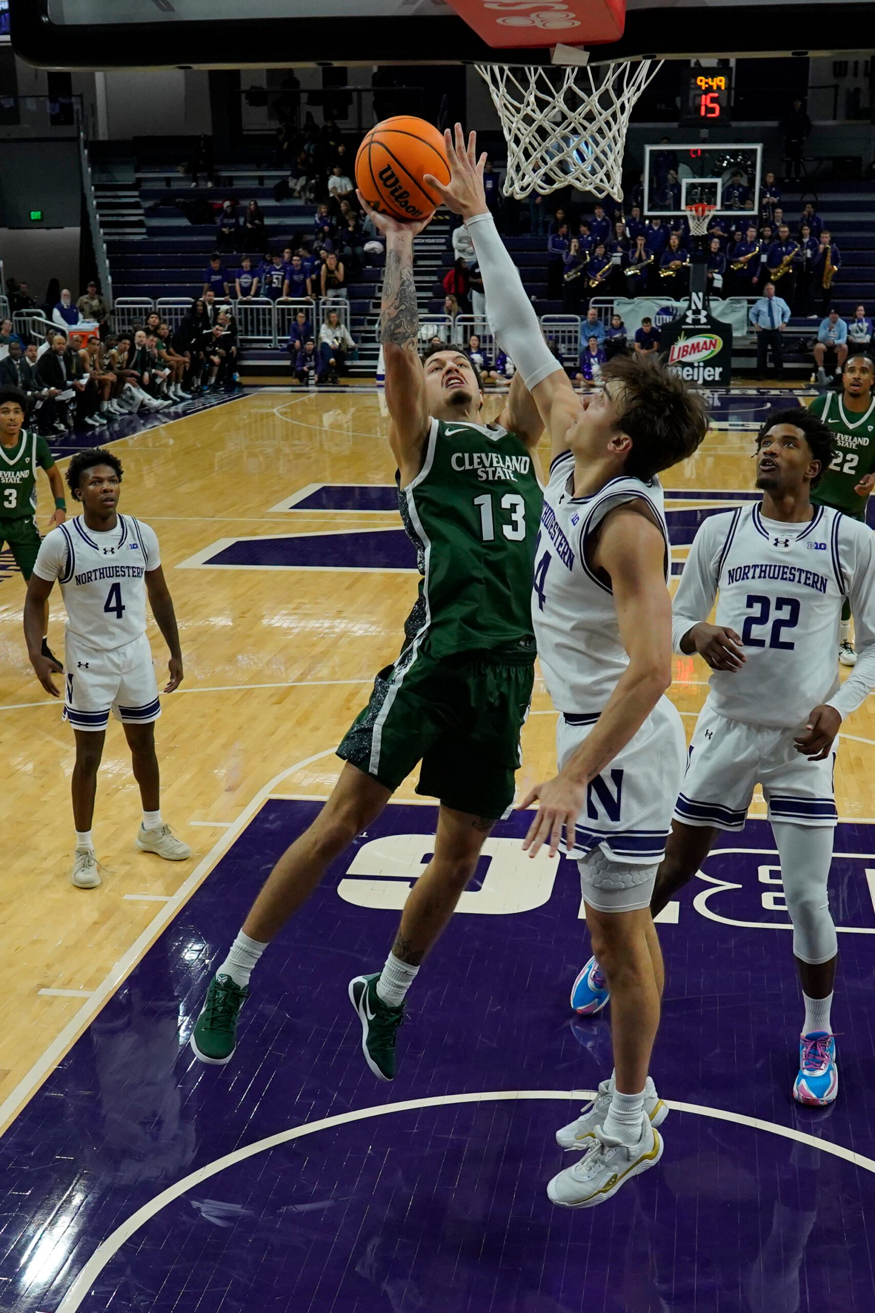 Nov 10, 2025; Evanston, Illinois, USA; Northwestern Wildcats guard Angelo Ciaravino (44) defends Cleveland State Vikings guard Lucas Burton (13) during the first half at Welsh-Ryan Arena. Mandatory Credit: David Banks-Imagn Images