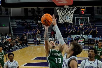 Nov 10, 2025; Evanston, Illinois, USA; Northwestern Wildcats guard Angelo Ciaravino (44) defends Cleveland State Vikings guard Lucas Burton (13) during the first half at Welsh-Ryan Arena. Mandatory Credit: David Banks-Imagn Images