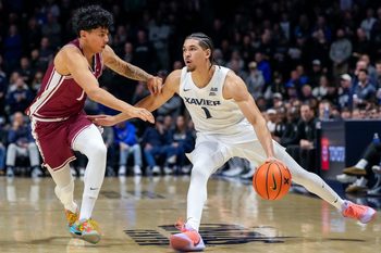Xavier Musketeers guard Malik Messina-Moore (1) drives against Santa Clara Broncos guard Christian Hammond (1) in the first half of the NCAA Men’s Basketball game between the Xavier Musketeers and the Santa Clara Broncos at the Cintas Center in Cincinnati on Monday, Nov. 10, 2025.