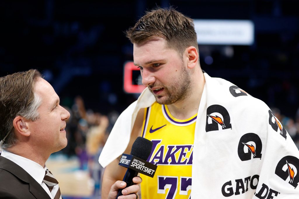 Nov 10, 2025; Charlotte, North Carolina, USA; Los Angeles Lakers forward/guard Luka Doncic (77) is interviewed following the game against the Charlotte Hornets at Spectrum Center. Mandatory Credit: Brian Westerholt-Imagn Images