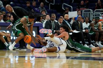 Nov 10, 2025; Evanston, Illinois, USA; Cleveland State Vikings guard Kamari Jones (24) forward Preist Ryan (4) and Northwestern Wildcats forward Arrinten Page (22) go for a loose ball during the second half at Welsh-Ryan Arena. Mandatory Credit: David Banks-Imagn Images