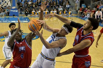 Nov 10, 2025; Los Angeles, California, USA;  West Georgia Wolves forward Shelton Williams-Dryden (4),  guard Chas Lewless (2) and UCLA Bruins guard Jamar Brown (4) battle for a rebound during the second half at Pauley Pavilion presented by Wescom Financial. Mandatory Credit: Jayne Kamin-Oncea-Imagn Images