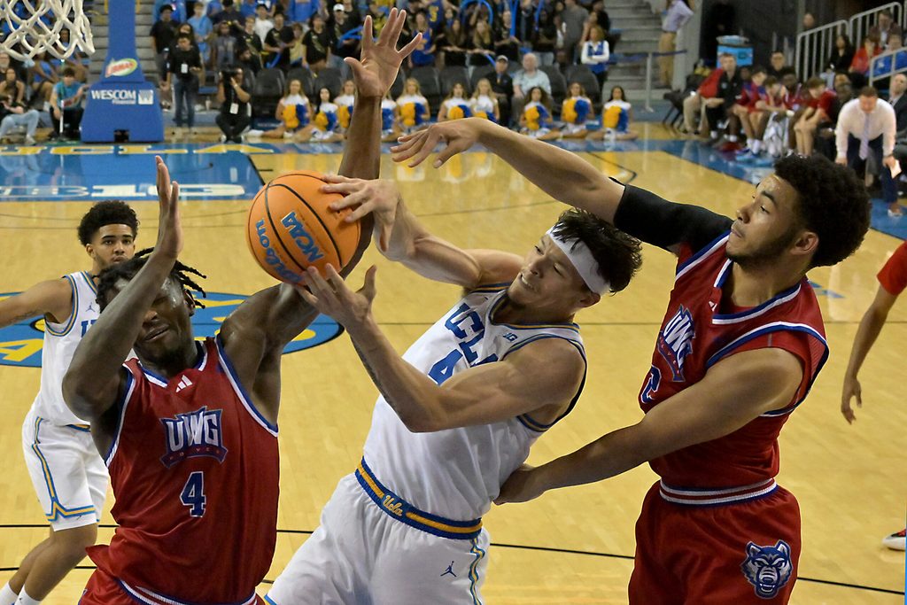 Nov 10, 2025; Los Angeles, California, USA; West Georgia Wolves forward Shelton Williams-Dryden (4), guard Chas Lewless (2) and UCLA Bruins guard Jamar Brown (4) battle for a rebound during the second half at Pauley Pavilion presented by Wescom Financial. Mandatory Credit: Jayne Kamin-Oncea-Imagn Images