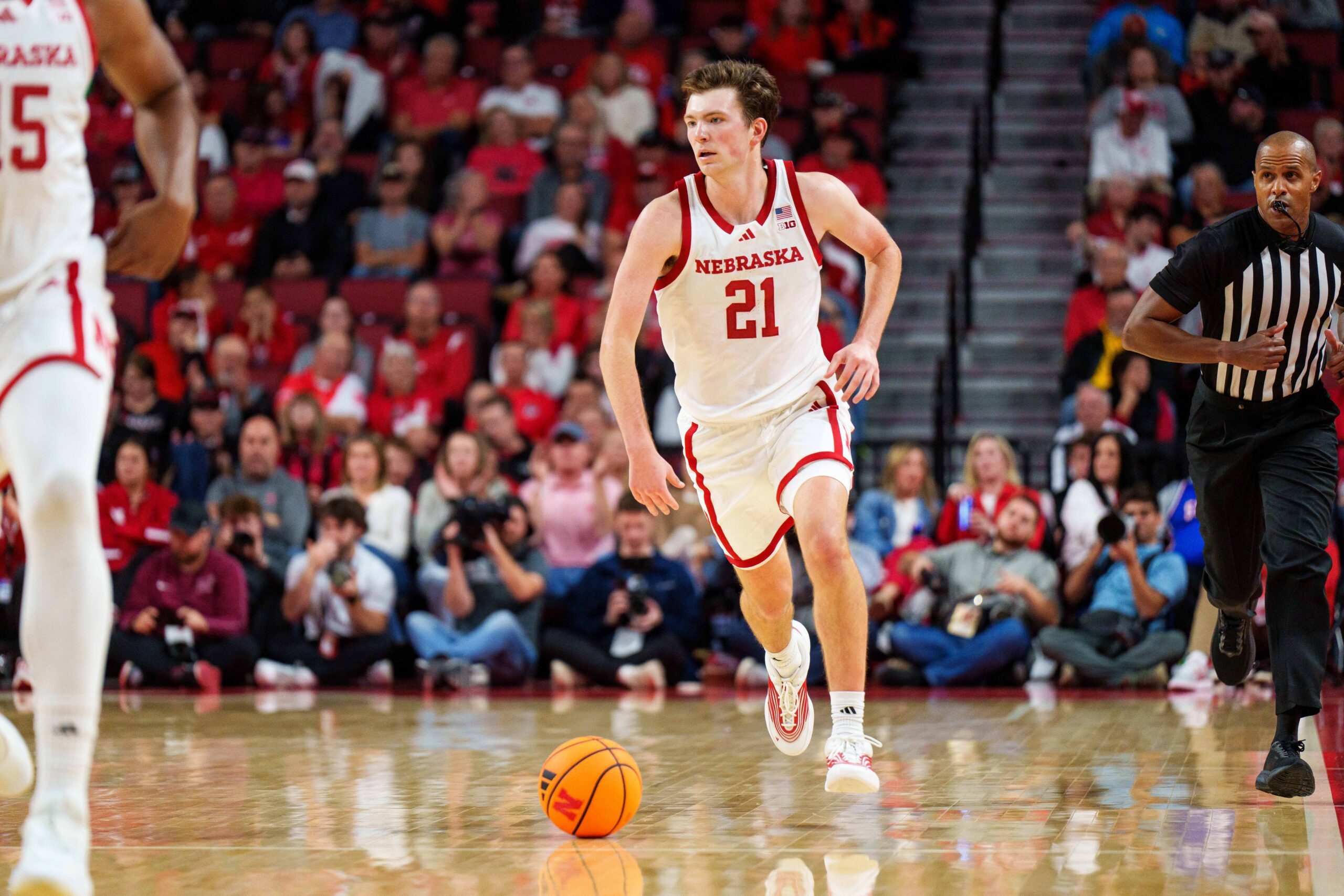 Nov 11, 2025; Lincoln, Nebraska, USA; Nebraska Cornhuskers forward Pryce Sandfort (21) drives against the Maryland Eastern Shore Hawks during the first half at Pinnacle Bank Arena. Mandatory Credit: Dylan Widger-Imagn Images