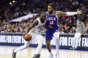 Nov 11, 2025; Philadelphia, Pennsylvania, USA; Boston Celtics guard Jaylen Brown (7) drives against Philadelphia 76ers forward Trendon Watford (12) during the second quarter at Xfinity Mobile Arena. Mandatory Credit: Bill Streicher-Imagn Images