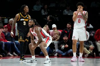 Ohio State Buckeyes guard Bruce Thornton (2) and guard John Mobley Jr. (0) react beside Appalachian State Mountaineers guard Jalen Tot (9) during the NCAA men's basketball game at Value City Arena in Columbus on Nov. 11, 2025. Ohio State won 75-53.