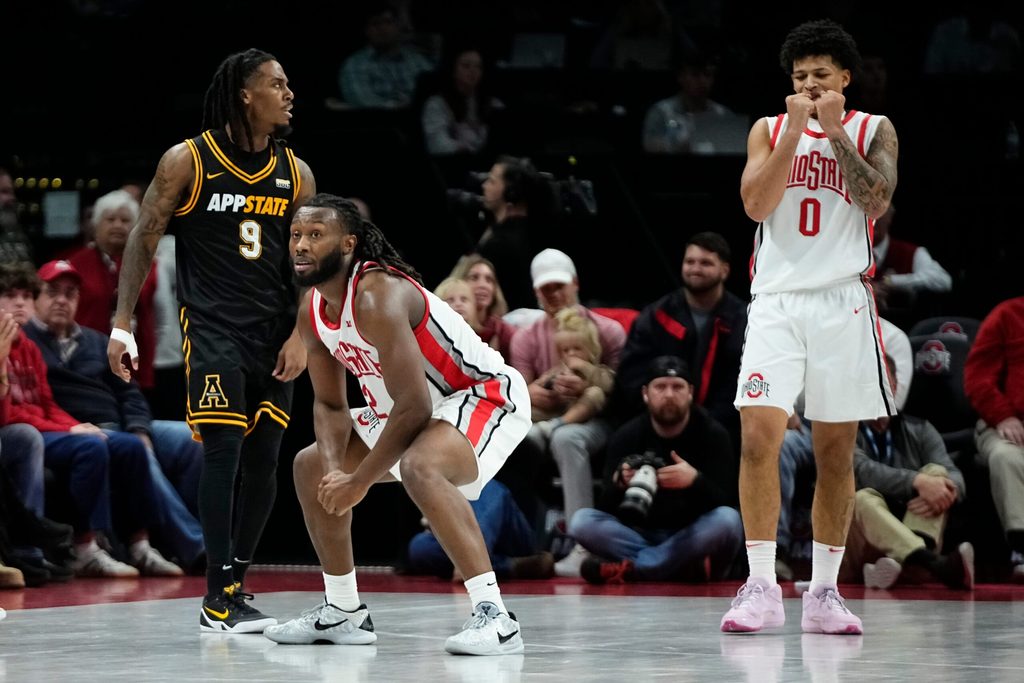 Ohio State Buckeyes guard Bruce Thornton (2) and guard John Mobley Jr. (0) react beside Appalachian State Mountaineers guard Jalen Tot (9) during the NCAA men's basketball game at Value City Arena in Columbus on Nov. 11, 2025. Ohio State won 75-53.