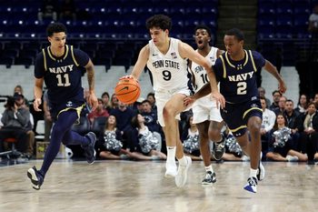 Nov 11, 2025; University Park, Pennsylvania, USA; Penn State Nittany Lions guard Melih Tunca (9) dribbles the ball up the court as Navy Midshipmen forward Donovan Draper (11) and guard Cam Cole (2) defend during the first half at Bryce Jordan Center. Mandatory Credit: Matthew O'Haren-Imagn Images