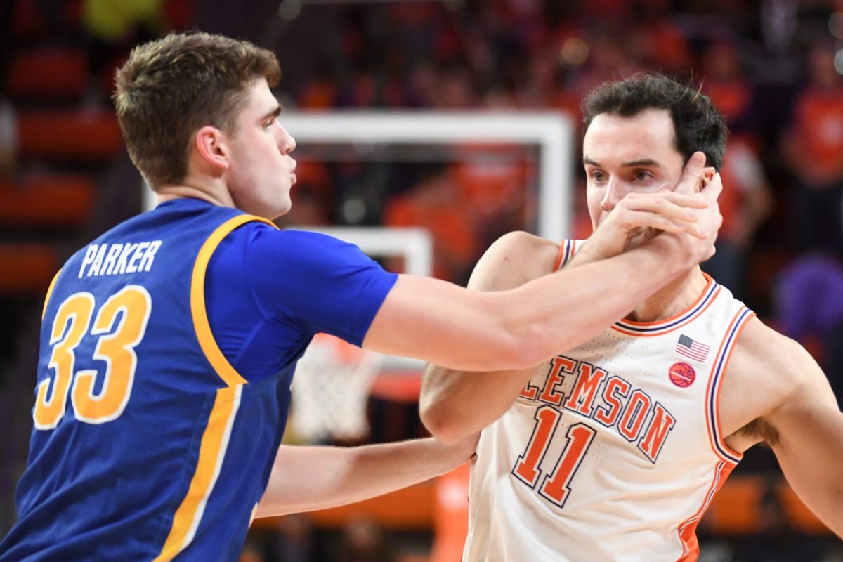 Morehead State Eagles forward Clayton Parker (33) defends Clemson Tigers forward Nick Davidson (11) Tuesday, Nov. 11, 2025, during the NCAA men’s basketball game at Littlejohn Coliseum in Clemson, South Carolina. Clemson Tigers won 83-56.