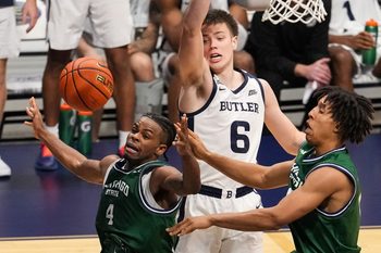 Butler Bulldogs forward Jack McCaffery (6) leaps for the ball against Chicago State Cougars guard Marcus Tankersley (4) on Tuesday, Nov. 11, 2025, during the game at Hinkle Fieldhouse in Indianapolis. The Butler Bulldogs defeated the Chicago State Cougars, 98-66.