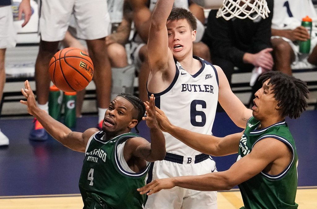Butler Bulldogs forward Jack McCaffery (6) leaps for the ball against Chicago State Cougars guard Marcus Tankersley (4) on Tuesday, Nov. 11, 2025, during the game at Hinkle Fieldhouse in Indianapolis. The Butler Bulldogs defeated the Chicago State Cougars, 98-66.