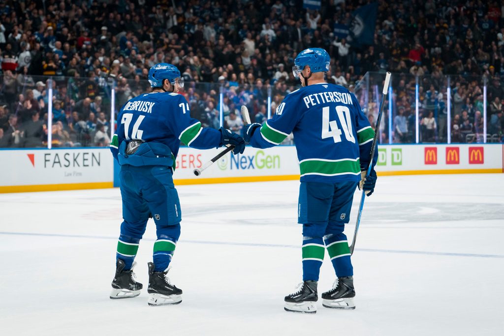 Nov 11, 2025; Vancouver, British Columbia, CAN; Vancouver Canucks forward Jake DeBrusk (74) and forward Elias Pettersson (40) celebrate DeBrusk’s goal against the Winnipeg Jets in the first period at Rogers Arena. Mandatory Credit: Bob Frid-Imagn Images