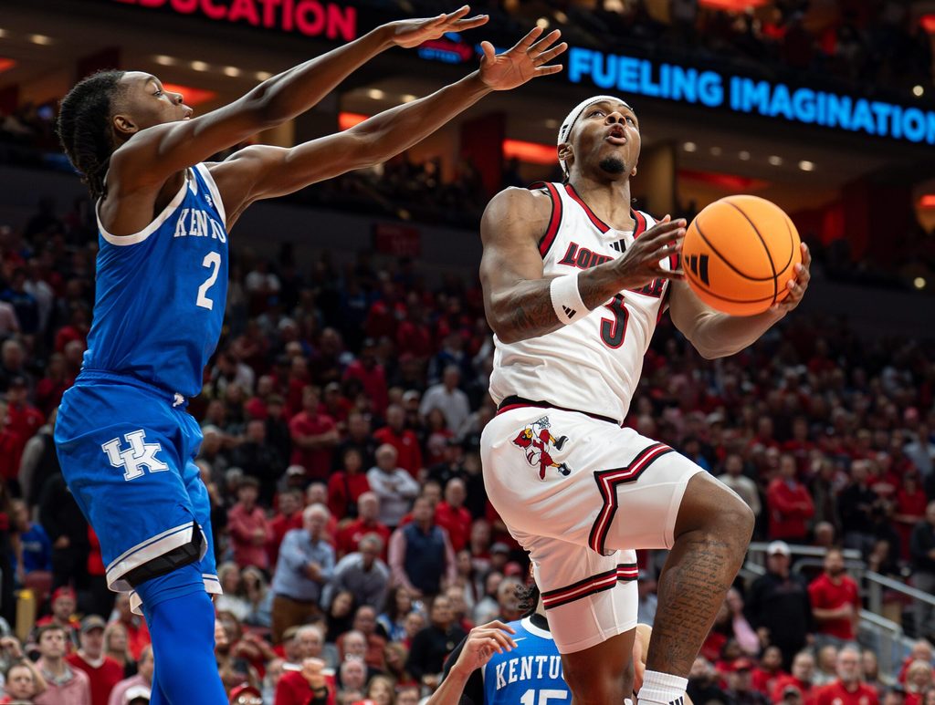 Louisville Cardinals guard Ryan Conwell (3) drove to the basket during the second half as the Louisville Cardinals hosted the Kentucky Wildcats at the KFC Yum! Center on Tuesday, Nov. 11, 2025. The Cardinals defeated the Wildcats 96-88.