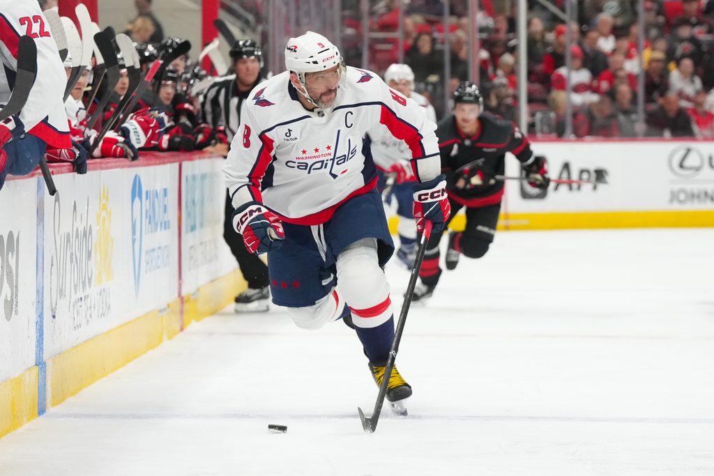 Nov 11, 2025; Raleigh, North Carolina, USA; Washington Capitals left wing Alex Ovechkin (8) skates with the puck against the Carolina Hurricanes during the second period at Lenovo Center. Mandatory Credit: James Guillory-Imagn Images