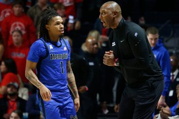 Nov 11, 2025; Oxford, Mississippi, USA; Memphis Tigers head coach Penny Hardaway talks with Memphis Tigers guard Dug McDaniel (1) during the second half against the Mississippi Rebels at The Sandy and John Black Pavilion at Ole Miss. Mandatory Credit: Petre Thomas-Imagn Images