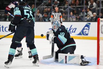 Nov 11, 2025; Seattle, Washington, USA; Seattle Kraken goaltender Matt Murray (30) blocks a goal shot against the Columbus Blue Jackets during the third period at Climate Pledge Arena. Mandatory Credit: Steven Bisig-Imagn Images