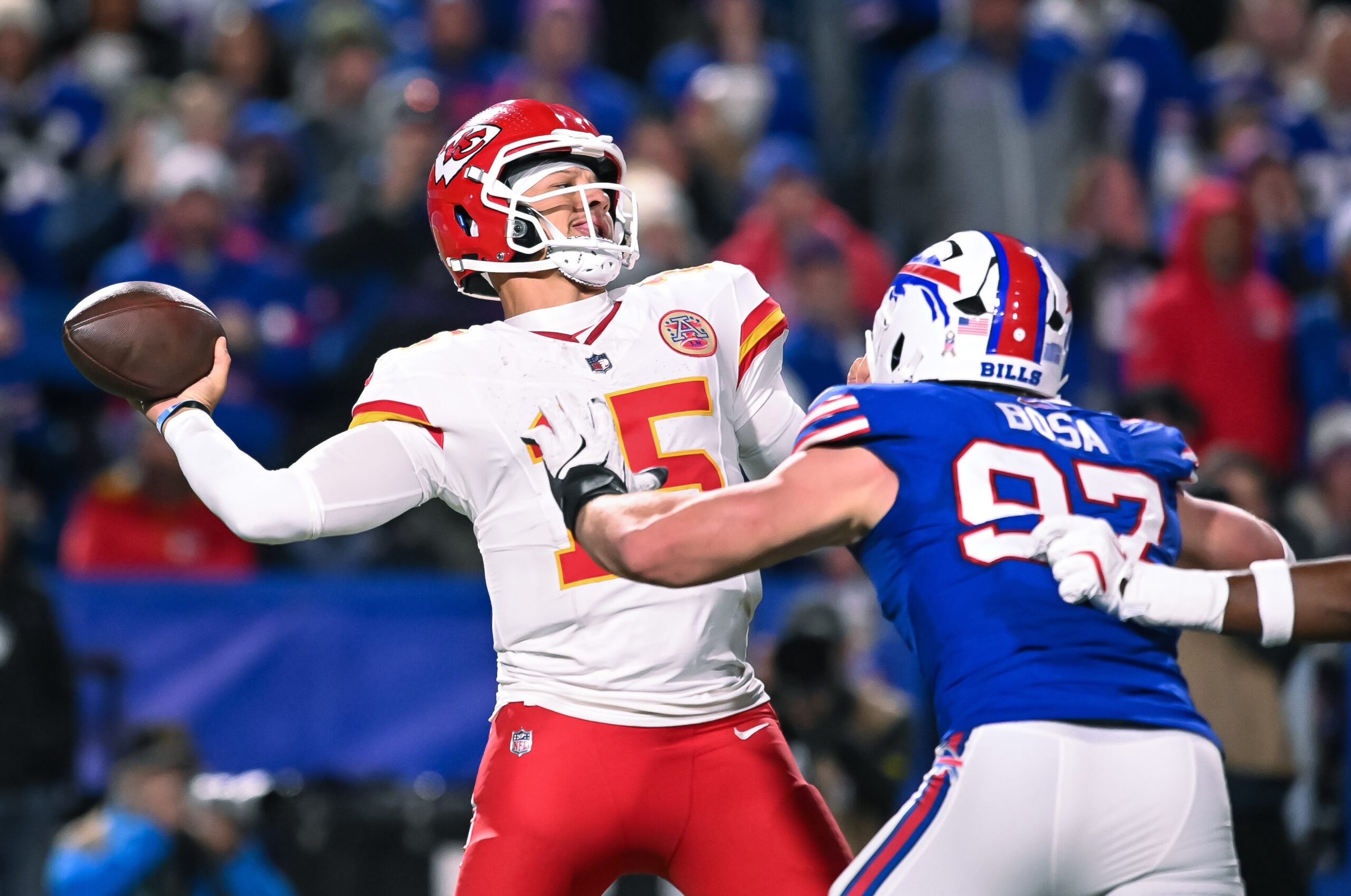 Nov 2, 2025; Orchard Park, New York, USA; Kansas City Chiefs quarterback Patrick Mahomes (15) throws a pass under pressure from Buffalo Bills defensive end Joey Bosa (97) in the fourth quarter at Highmark Stadium. Mandatory Credit: Mark Konezny-Imagn Images