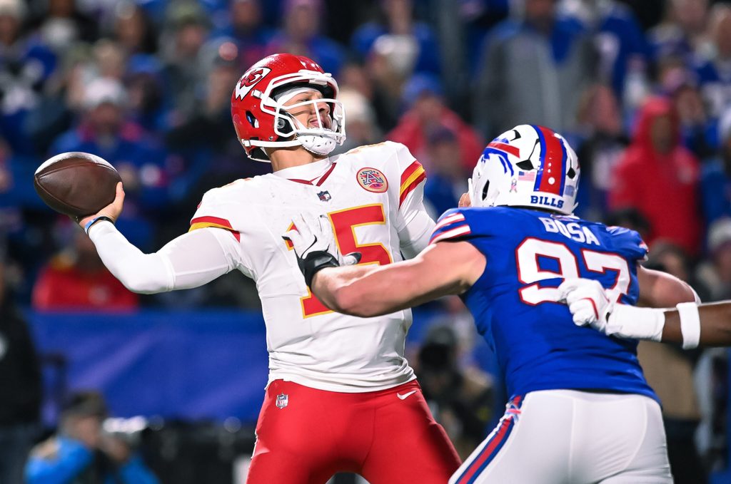 Nov 2, 2025; Orchard Park, New York, USA; Kansas City Chiefs quarterback Patrick Mahomes (15) throws a pass under pressure from Buffalo Bills defensive end Joey Bosa (97) in the fourth quarter at Highmark Stadium. Mandatory Credit: Mark Konezny-Imagn Images