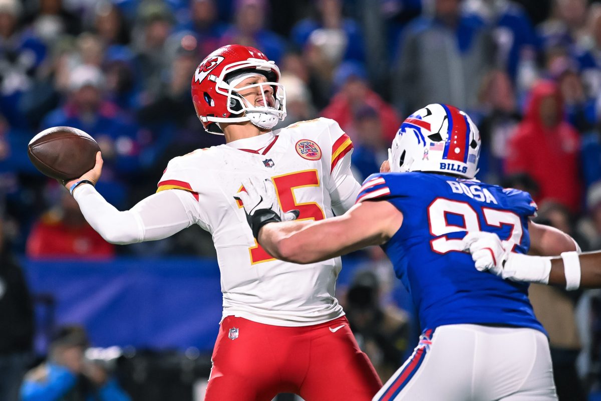 Nov 2, 2025; Orchard Park, New York, USA; Kansas City Chiefs quarterback Patrick Mahomes (15) throws a pass under pressure from Buffalo Bills defensive end Joey Bosa (97) in the fourth quarter at Highmark Stadium. Mandatory Credit: Mark Konezny-Imagn Images