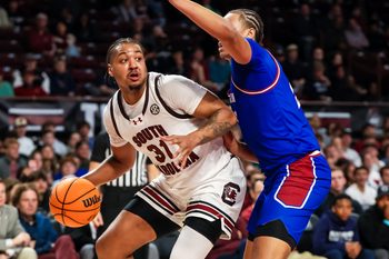 Nov 12, 2025; Columbia, South Carolina, USA; South Carolina Gamecocks forward Elijah Strong (31) attempts to get around Presbyterian Blue Hose forward Jonah Pierce (15) in the first half at Colonial Life Arena. Mandatory Credit: Jeff Blake-Imagn Images