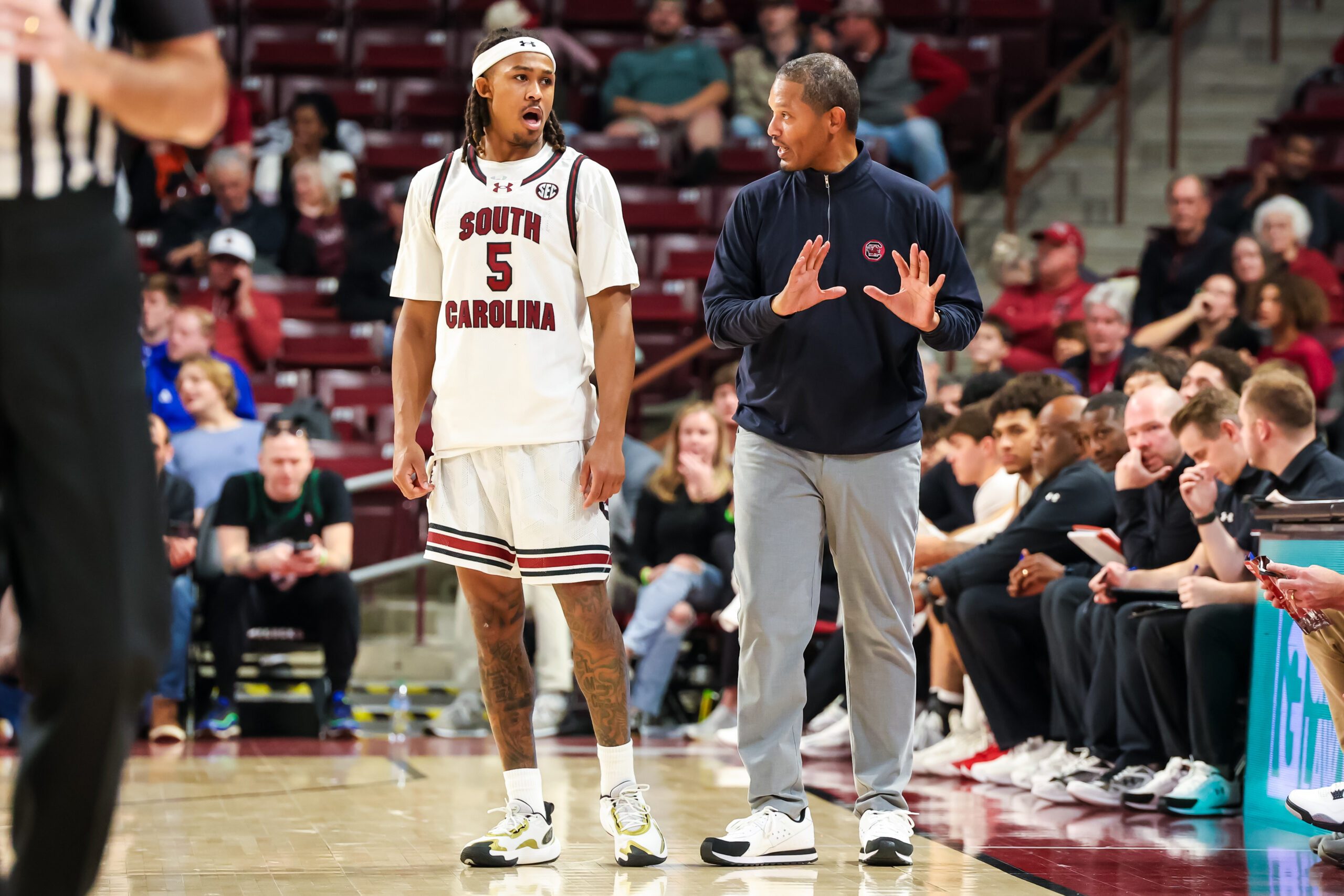 Nov 12, 2025; Columbia, South Carolina, USA; South Carolina Gamecocks head coach Lamont Paris speaks with guard Meechie Johnson (5) against the Presbyterian Blue Hose in the second half at Colonial Life Arena. Mandatory Credit: Jeff Blake-Imagn Images