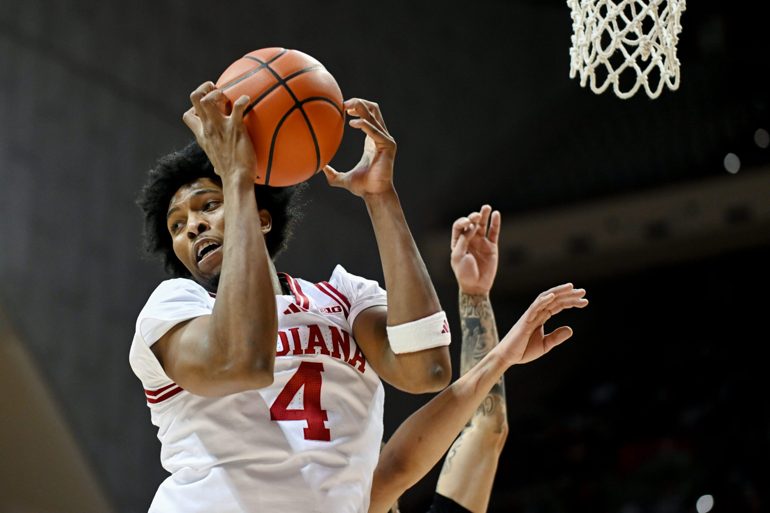 Nov 12, 2025; Bloomington, Indiana, USA; Indiana Hoosiers forward Sam Alexis (4) rebounds the ball during the second half against the Milwaukee Panthers at Simon Skjodt Assembly Hall. Mandatory Credit: Robert Goddin-Imagn Images