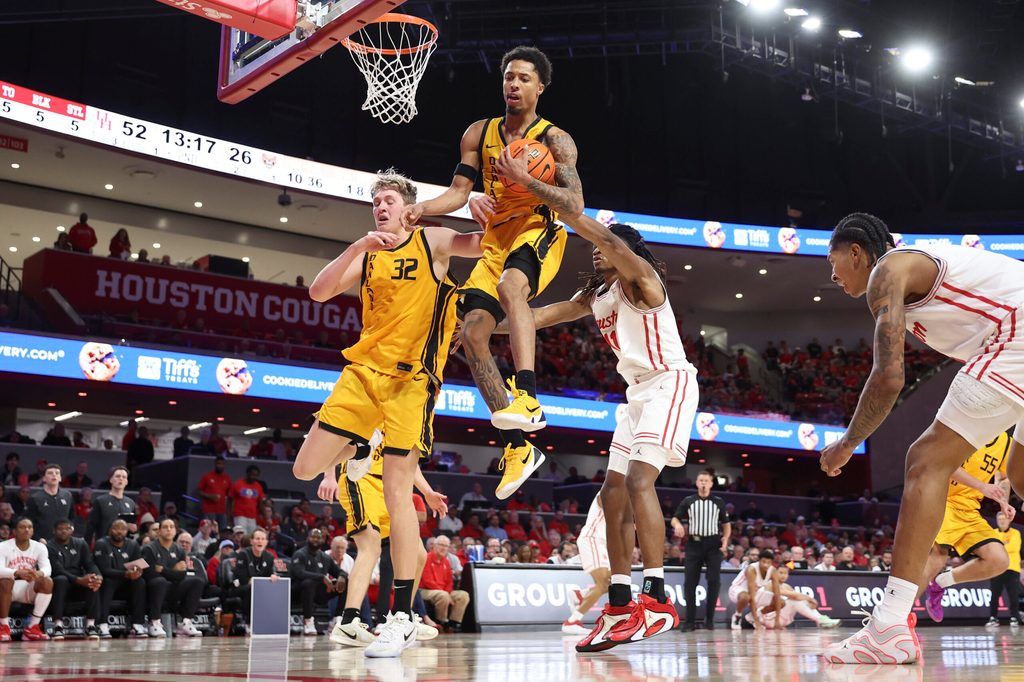 Nov 12, 2025; Houston, Texas, USA; Oakland Golden Grizzlies guard Ziare Wells (2) grabs a rebound during the second half against the Houston Cougars at Fertitta Center. Mandatory Credit: Troy Taormina-Imagn Images