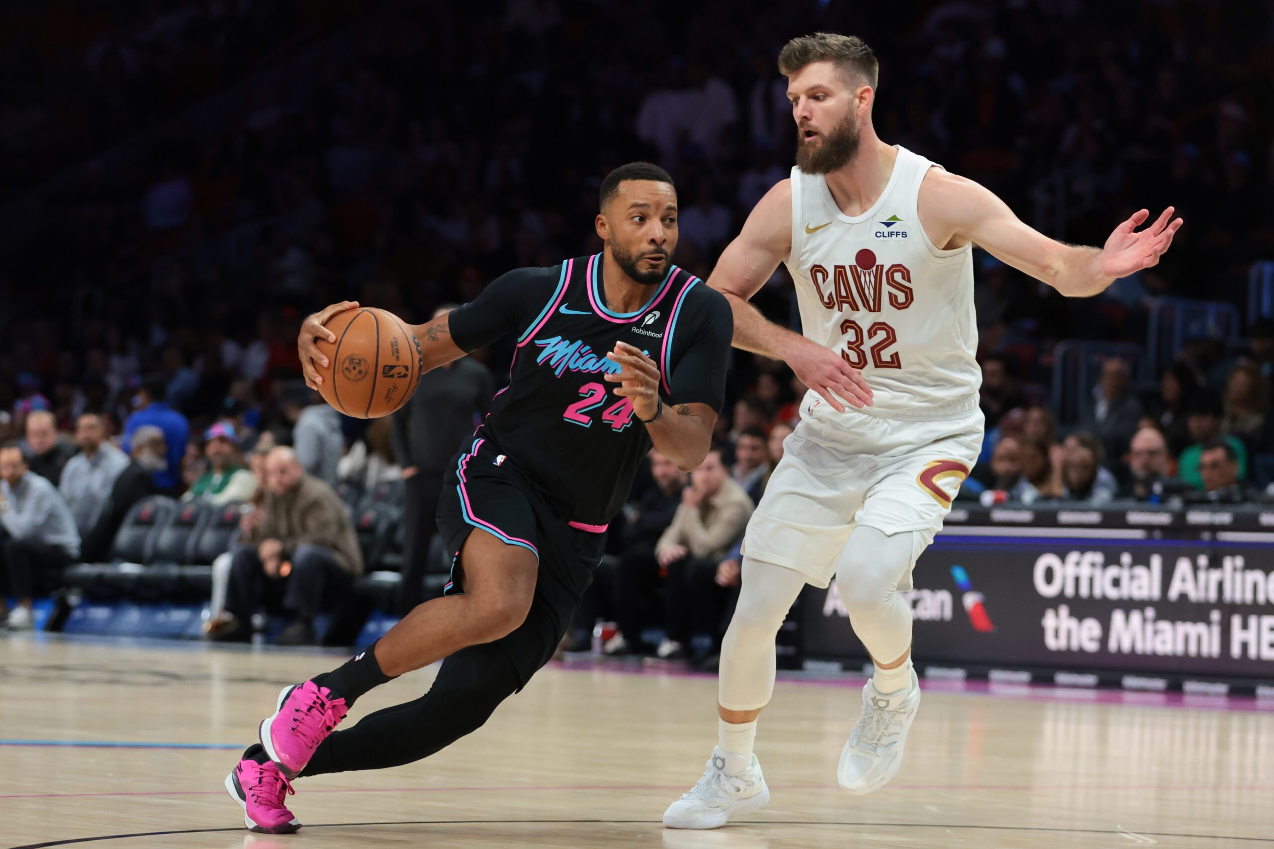 Nov 12, 2025; Miami, Florida, USA; Miami Heat guard Norman Powell (24) drives to the basket against Cleveland Cavaliers forward Dean Wade (32) during the third quarter at Kaseya Center. Mandatory Credit: Sam Navarro-Imagn Images