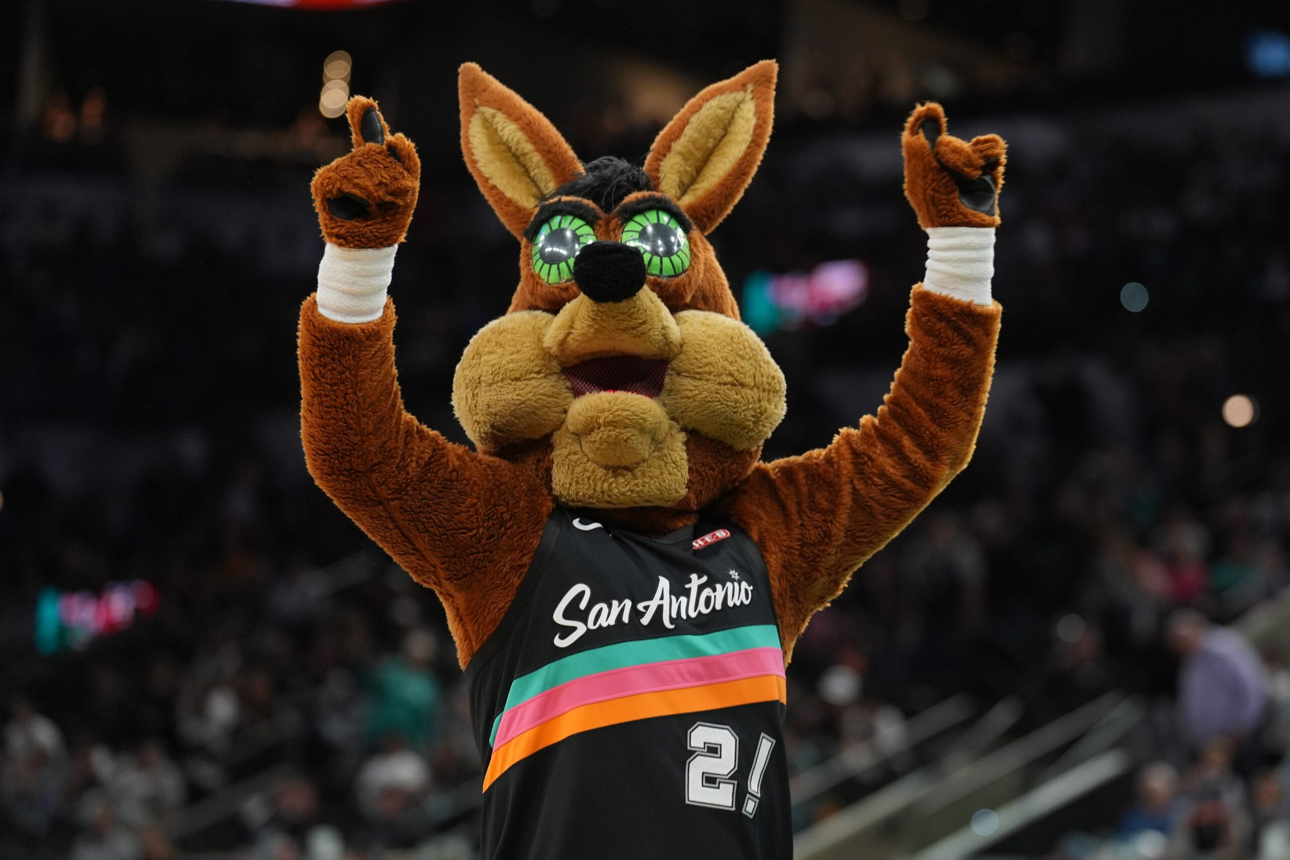 Nov 12, 2025; San Antonio, Texas, USA; The San Antonio Spurs Coyote performs in the second half against the Golden State Warriors at Frost Bank Center. Mandatory Credit: Daniel Dunn-Imagn Images
