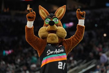 Nov 12, 2025; San Antonio, Texas, USA;  The San Antonio Spurs Coyote performs in the second half against the Golden State Warriors at Frost Bank Center. Mandatory Credit: Daniel Dunn-Imagn Images
