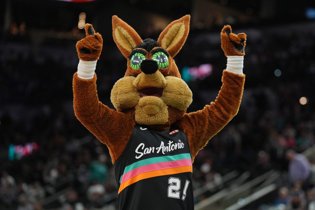 Nov 12, 2025; San Antonio, Texas, USA; The San Antonio Spurs Coyote performs in the second half against the Golden State Warriors at Frost Bank Center. Mandatory Credit: Daniel Dunn-Imagn Images