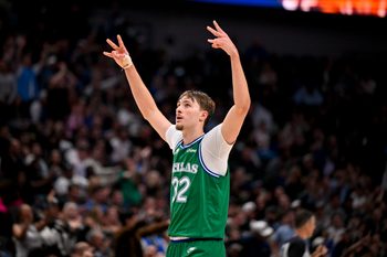 Nov 12, 2025; Dallas, Texas, USA; Dallas Mavericks forward Cooper Flagg (32) celebrates a three point basket by guard Max Christie (not pictured) against the Phoenix Suns during the second half at the American Airlines Center. Mandatory Credit: Jerome Miron-Imagn Images