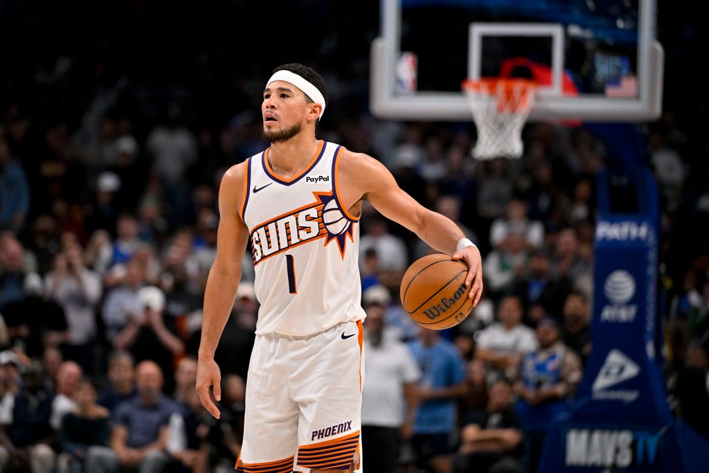Nov 12, 2025; Dallas, Texas, USA; Phoenix Suns guard Devin Booker (1) brings the ball up court against the Dallas Mavericks during the second half at the American Airlines Center. Mandatory Credit: Jerome Miron-Imagn Images
