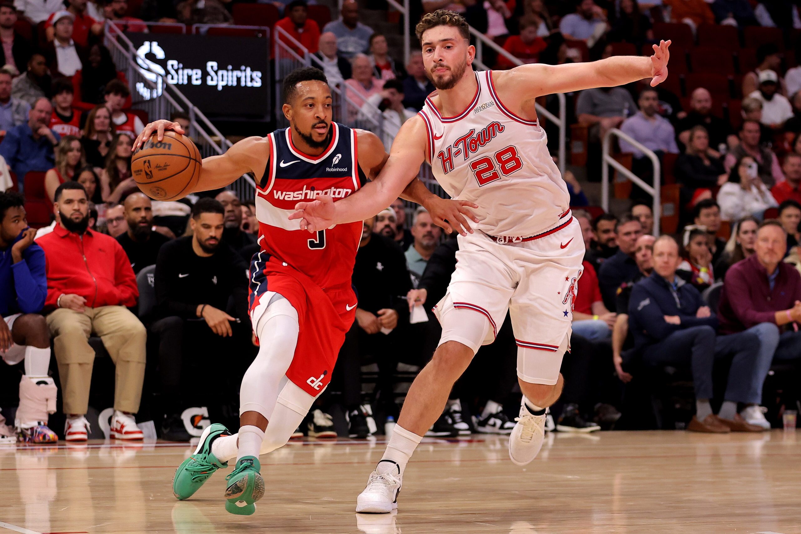 Nov 12, 2025; Houston, Texas, USA; Washington Wizards guard CJ McCollum (3) drives to the basket against Houston Rockets center Alperen Sengun (28) during the game at Toyota Center. Mandatory Credit: Erik Williams-Imagn Images
