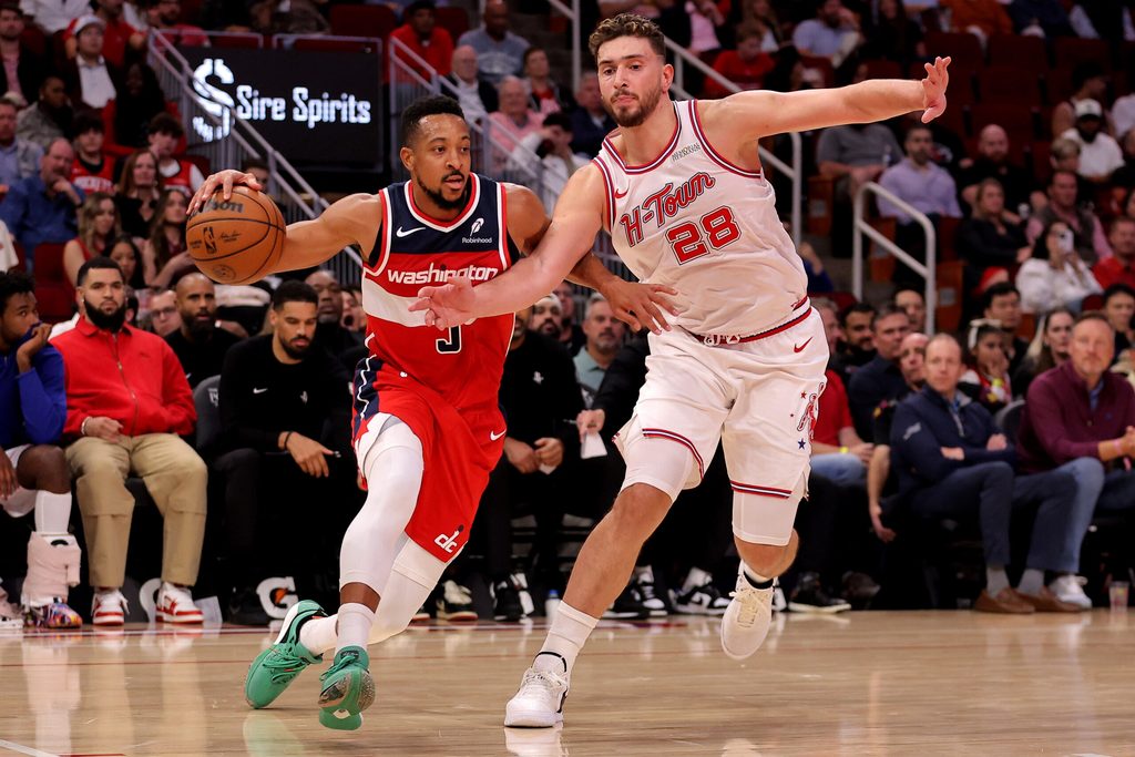 Nov 12, 2025; Houston, Texas, USA; Washington Wizards guard CJ McCollum (3) drives to the basket against Houston Rockets center Alperen Sengun (28) during the game at Toyota Center. Mandatory Credit: Erik Williams-Imagn Images