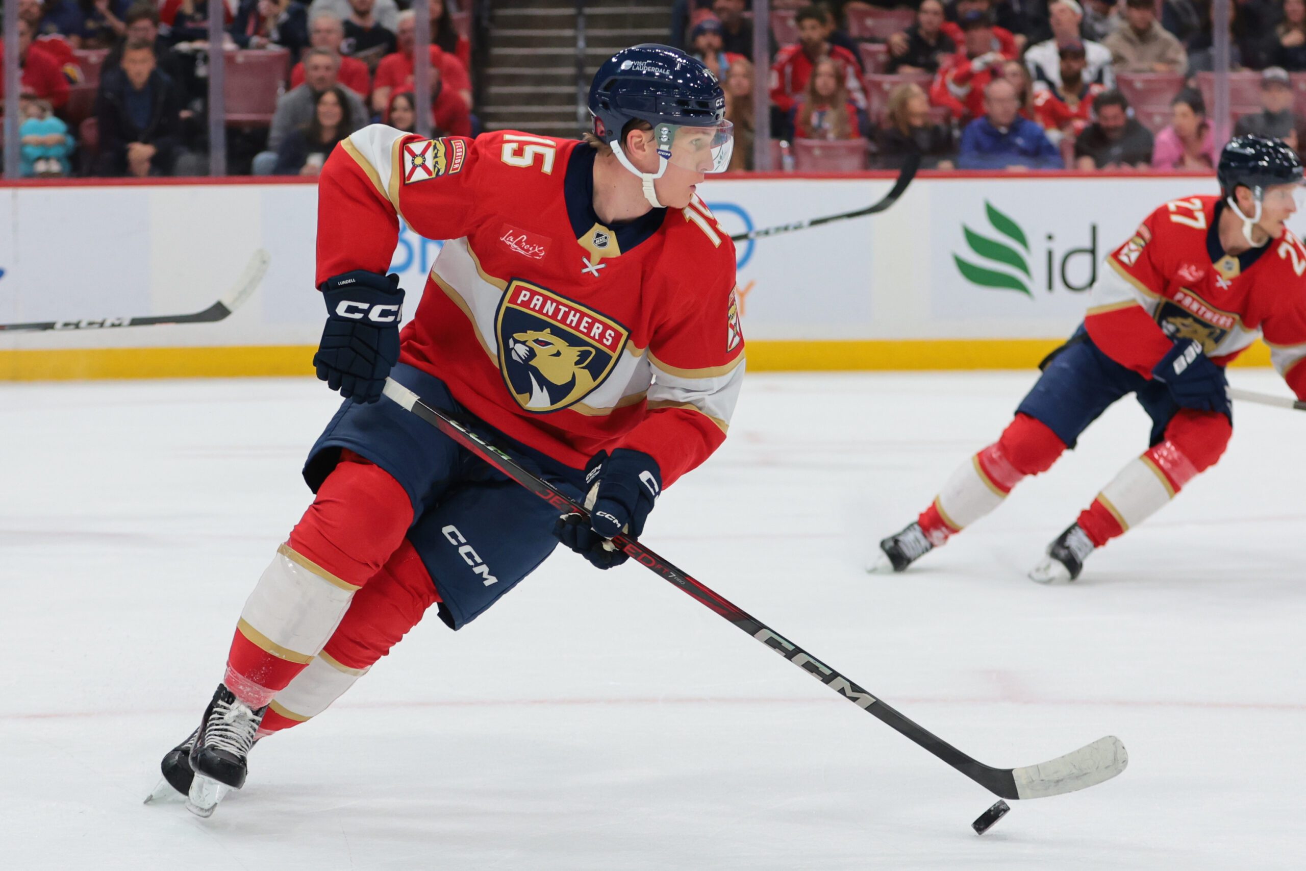 Nov 13, 2025; Sunrise, Florida, USA; Florida Panthers center Anton Lundell (15) moves the puck against the Washington Capitals during the first period at Amerant Bank Arena. Mandatory Credit: Sam Navarro-Imagn Images