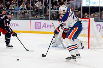 Nov 13, 2025; Columbus, Ohio, USA; Edmonton Oilers center Leon Draisaitl (29) receives a pass in front of Columbus Blue Jackets defenseman Dante Fabbro (15) during the first period at Nationwide Arena. Mandatory Credit: Russell LaBounty-Imagn Images