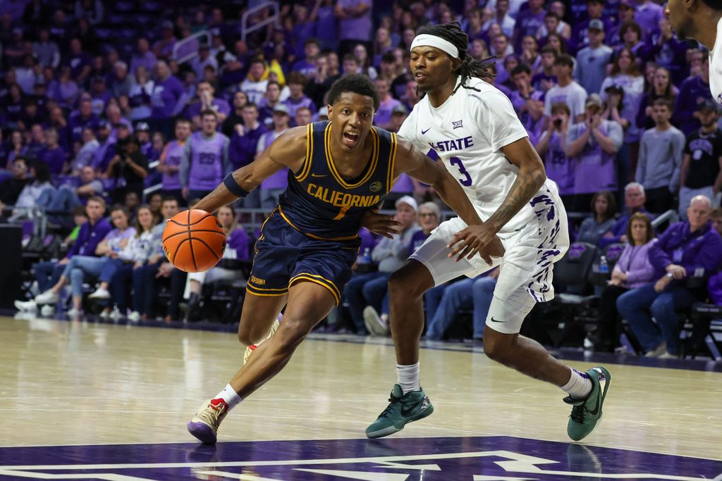 Nov 13, 2025; Manhattan, Kansas, USA; California Golden Bears guard Dai Dai Ames (7) drives against Kansas State Wildcats guard C.J. Jones (3) during the second half at Bramlage Coliseum. Mandatory Credit: Scott Sewell-Imagn Images