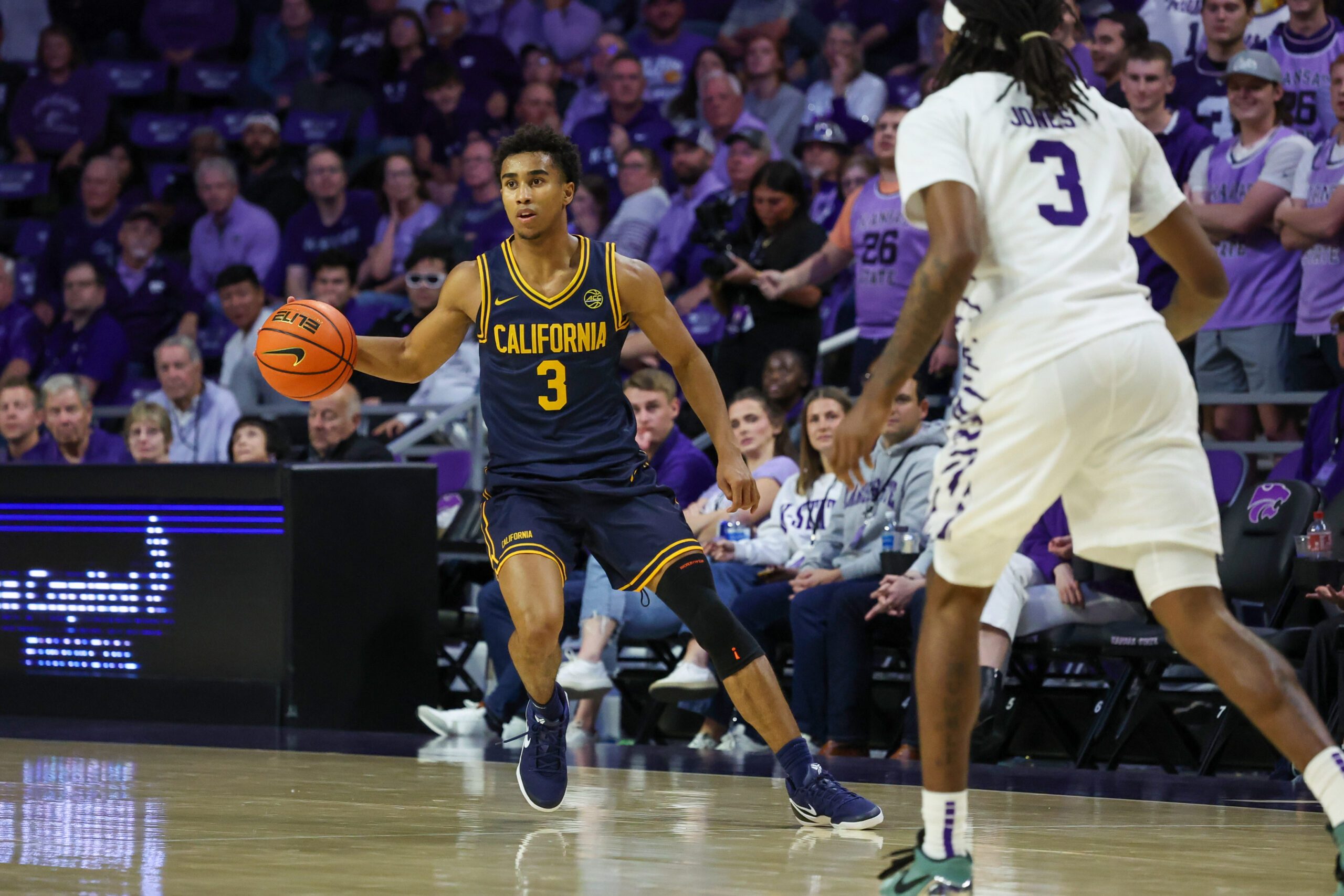 Nov 13, 2025; Manhattan, Kansas, USA; California Golden Bears guard Semetri Carr (3) brings the ball up court against Kansas State Wildcats guard C.J. Jones (3) during the second half at Bramlage Coliseum. Mandatory Credit: Scott Sewell-Imagn Images