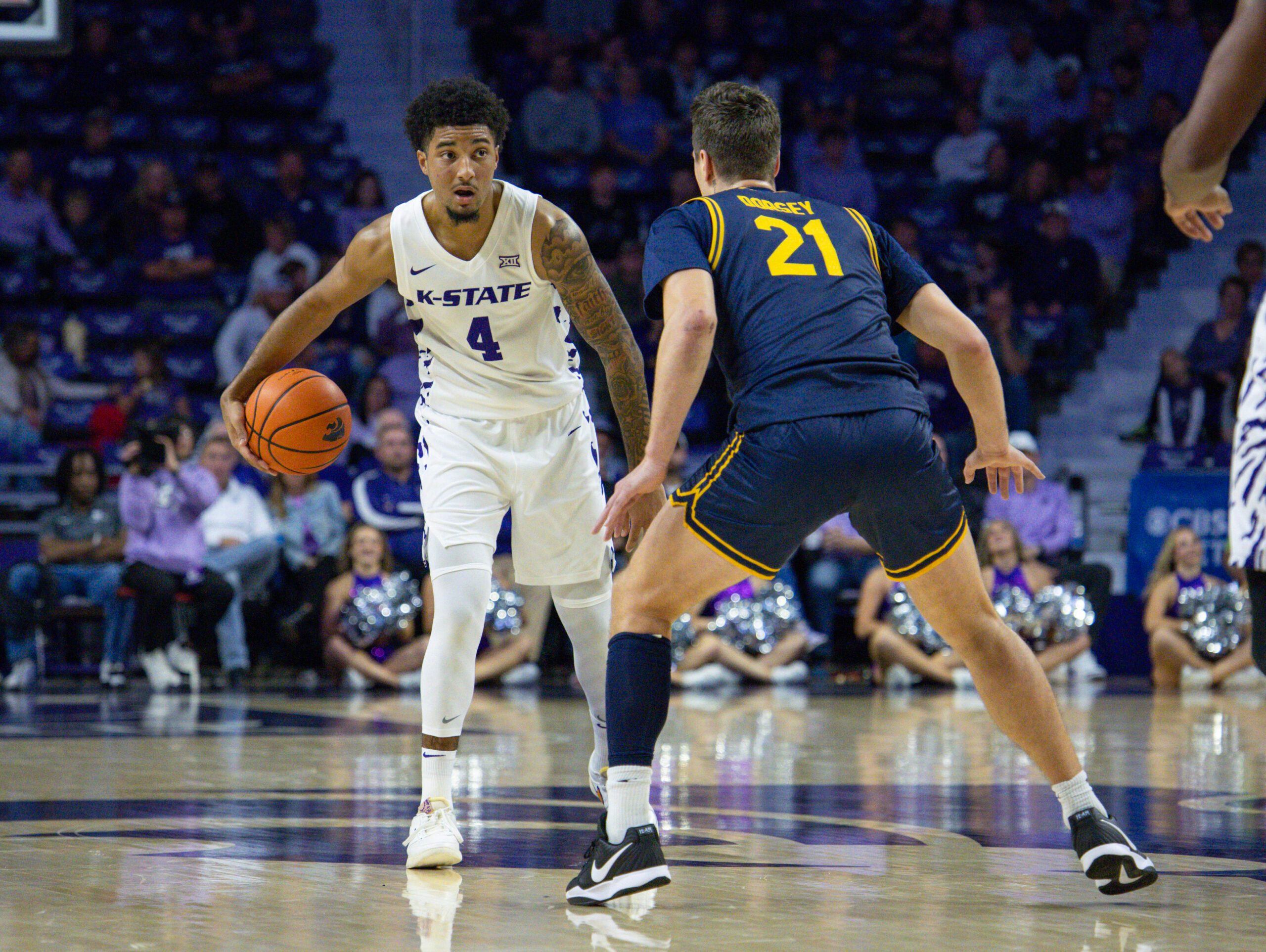 Nov 13, 2025; Manhattan, Kansas, USA; Kansas State Wildcats guard P.J. Haggerty (4) is guarded by California Golden Bears guard Nolan Dorsey (21) during the first half at Bramlage Coliseum. Mandatory Credit: Scott Sewell-Imagn Images