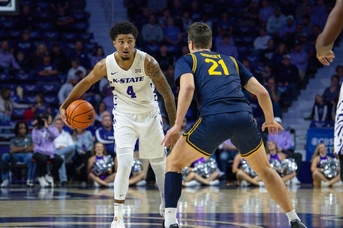 Nov 13, 2025; Manhattan, Kansas, USA; Kansas State Wildcats guard P.J. Haggerty (4) is guarded by California Golden Bears guard Nolan Dorsey (21) during the first half at Bramlage Coliseum. Mandatory Credit: Scott Sewell-Imagn Images