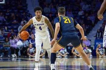 Nov 13, 2025; Manhattan, Kansas, USA; Kansas State Wildcats guard P.J. Haggerty (4) is guarded by California Golden Bears guard Nolan Dorsey (21) during the first half at Bramlage Coliseum. Mandatory Credit: Scott Sewell-Imagn Images
