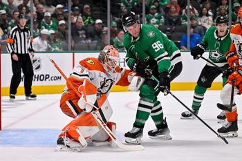 Nov 6, 2025; Dallas, Texas, USA; Anaheim Ducks goaltender Lukas Dostal (1) and Dallas Stars right wing Mikko Rantanen (96) during the game between the Stars and the Ducks at the American Airlines Center. Mandatory Credit: Jerome Miron-Imagn Images