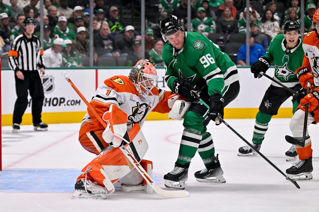 Nov 6, 2025; Dallas, Texas, USA; Anaheim Ducks goaltender Lukas Dostal (1) and Dallas Stars right wing Mikko Rantanen (96) during the game between the Stars and the Ducks at the American Airlines Center. Mandatory Credit: Jerome Miron-Imagn Images