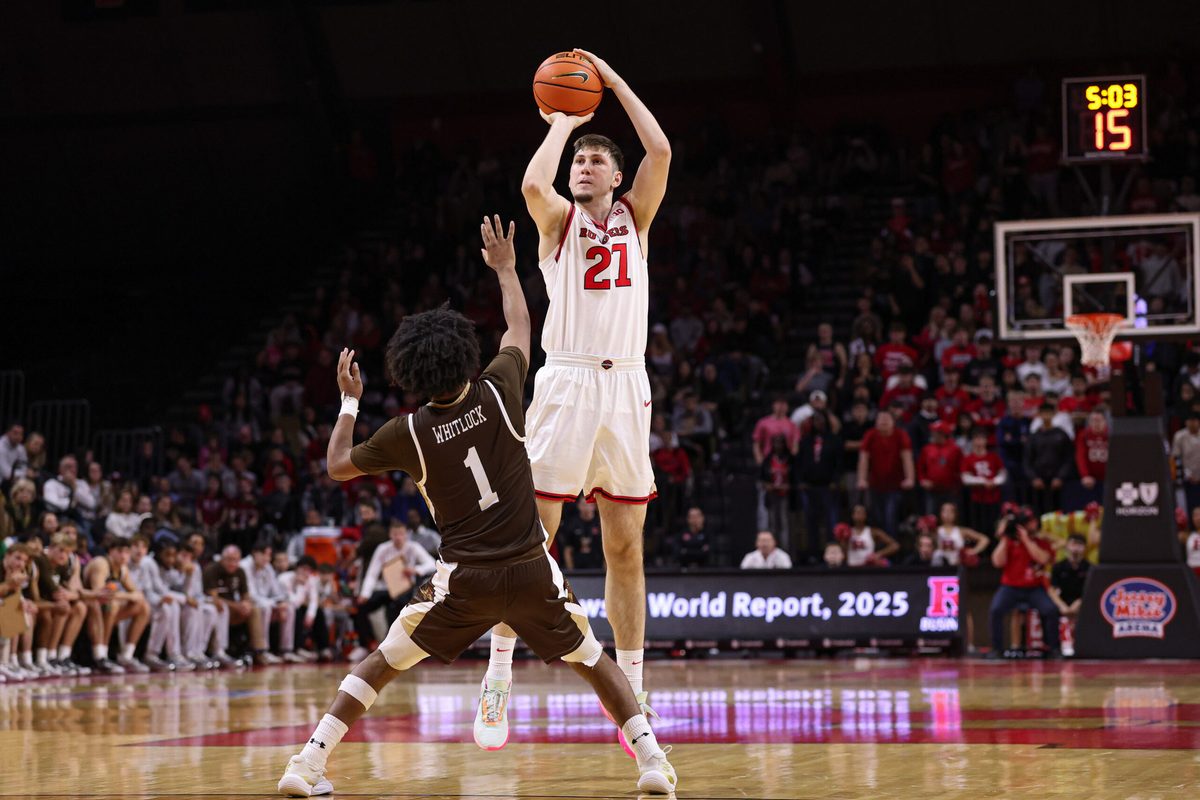 Nov 14, 2025; Piscataway, New Jersey, USA; Rutgers Scarlet Knights center Emmanuel Ogbole (21) shoots the ball as Lehigh Mountain Hawks guard Nasir Whitlock (1) defends during the second half at Jersey Mike's Arena. Mandatory Credit: Vincent Carchietta-Imagn Images